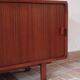 Teak enfilade, sliding doors, black faux leather top, 1970s.