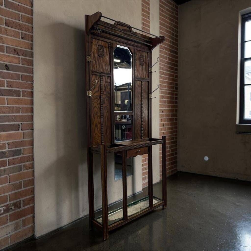 Vintage wooden coat rack with mirror.