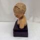 Girl's head in terracotta numbered