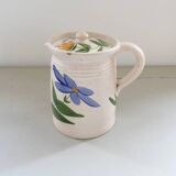 Old earthenware pitcher with its lid
