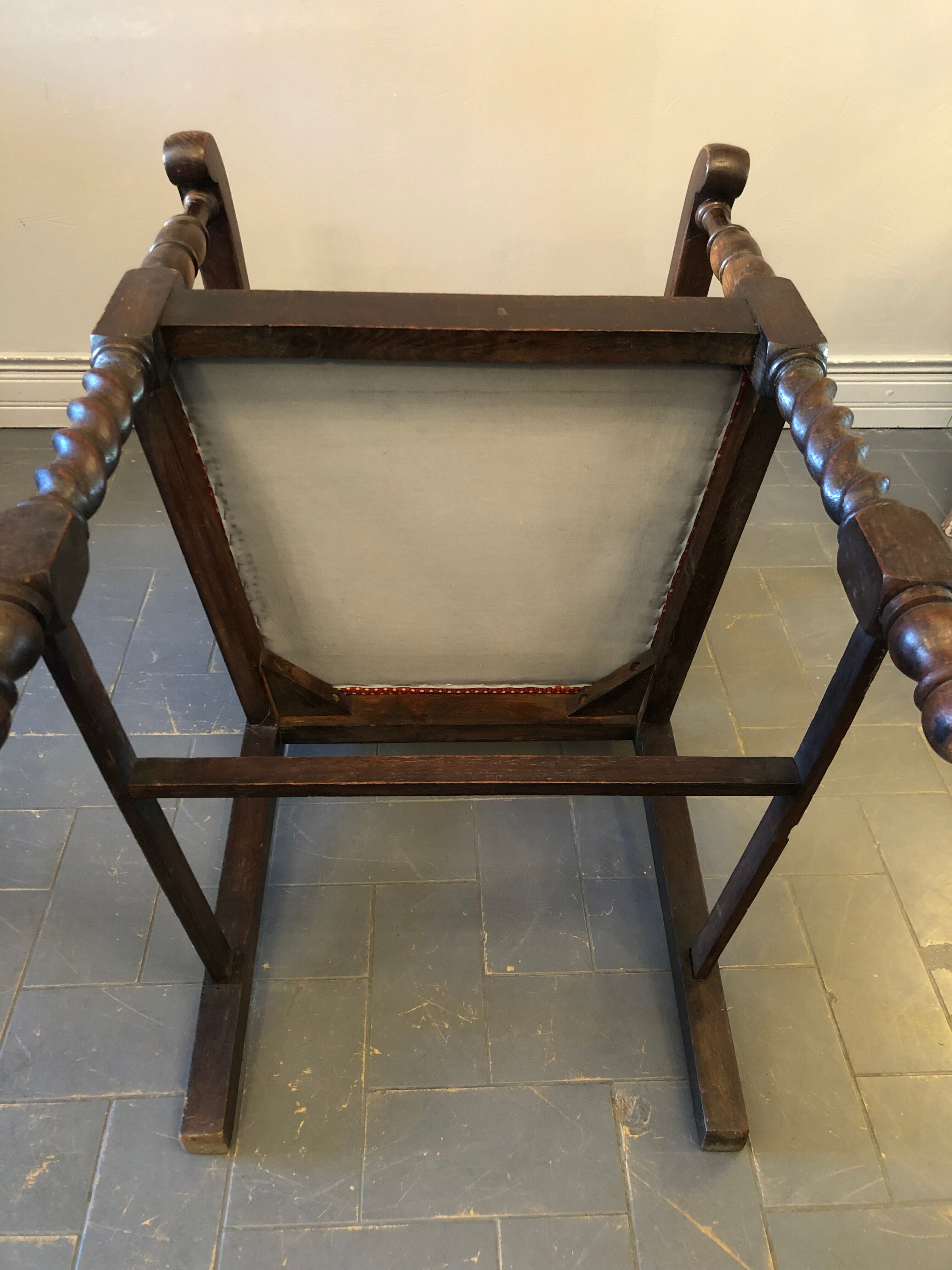 Carved wooden armchair and cannage