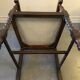 Fauteuil en bois sculpté et cannage