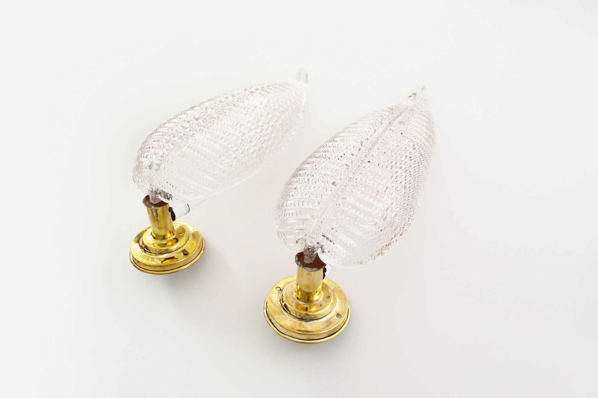 Pair of brass and muranoglass shell sconces