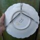 Old Gien earthenware scalloped plate with blue/yellow flower basket motifs