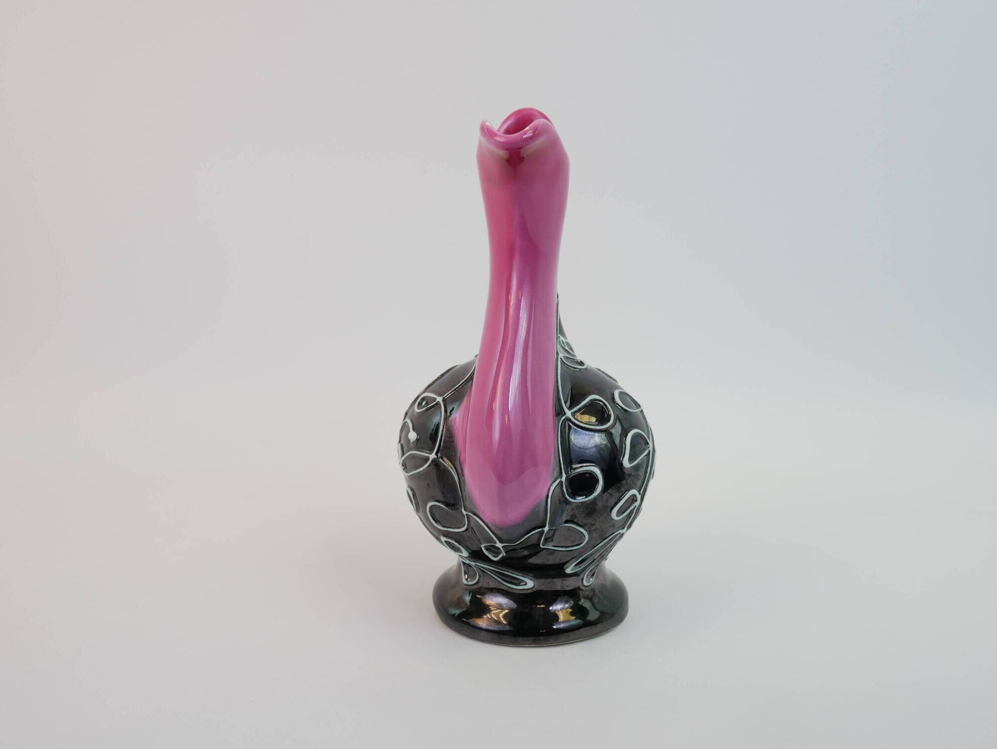 Black and pink Vallauris carafe with white relief patterns