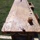 Old solid wood carpenter's bench with 2 functional vices.