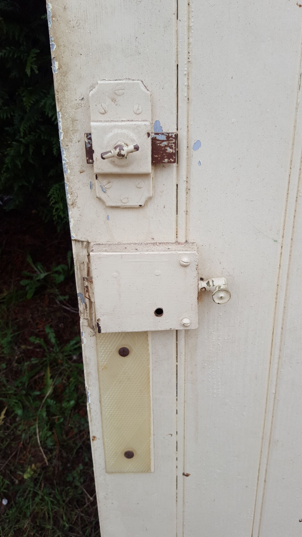 Old door in cream lacquered wood