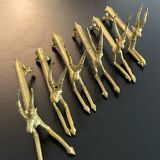 6 brass antelope-shaped knife holders