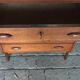 Danish commode from the 1960s in brown teak, with 4 drawers and elegant tapered legs.