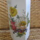 Flowery white porcelain faceted vase