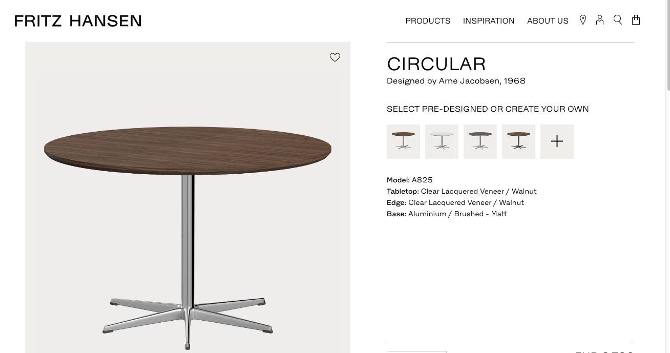 Dining table with a star-shaped six-legged base by Arne Jacobsen for Fritz Hansen.