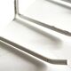 Vintage white metal wall trade coat rack