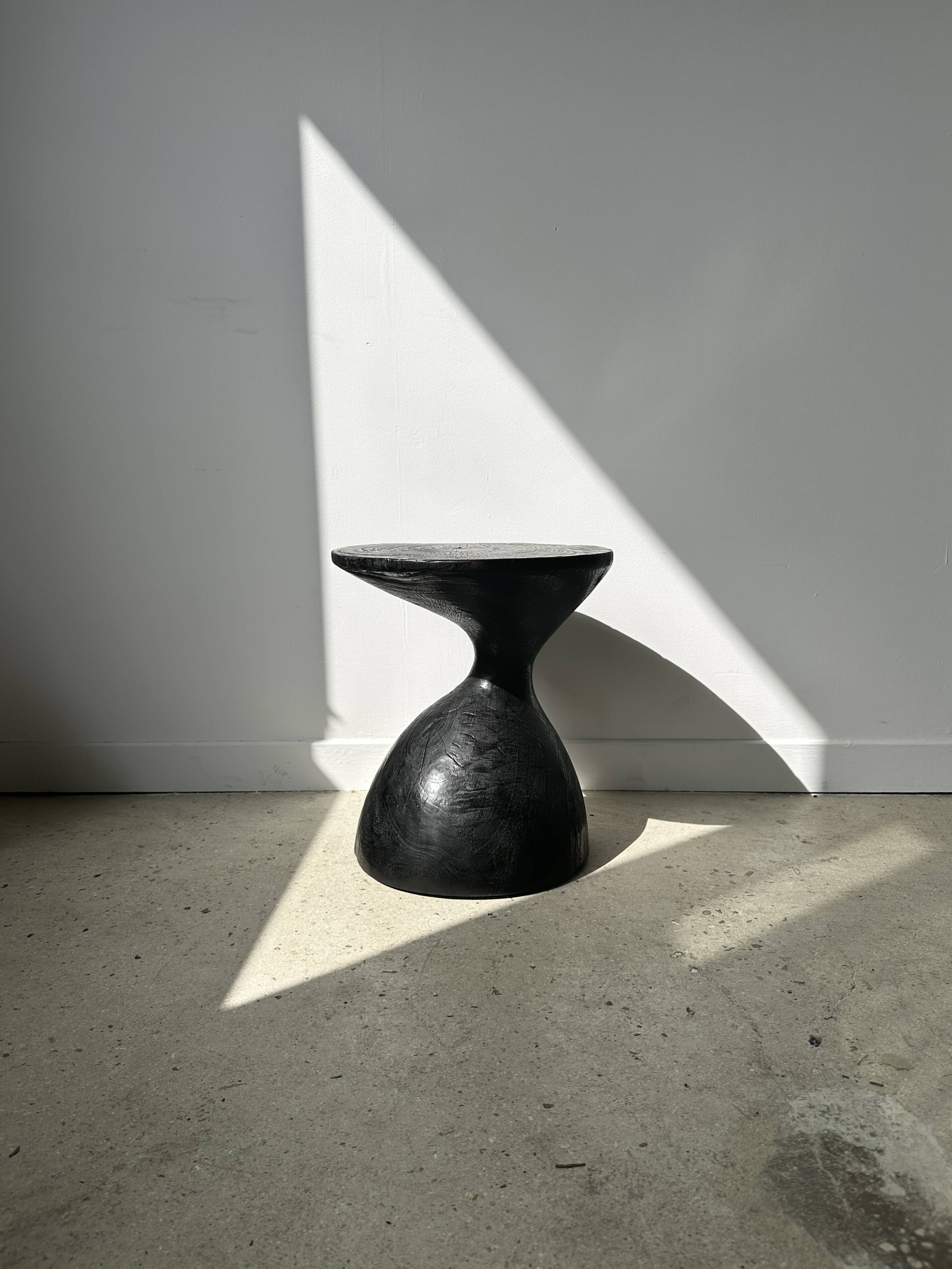 Solid wood (monoxyl) side table, organic shape, black color