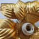 Golden metal flower sconce