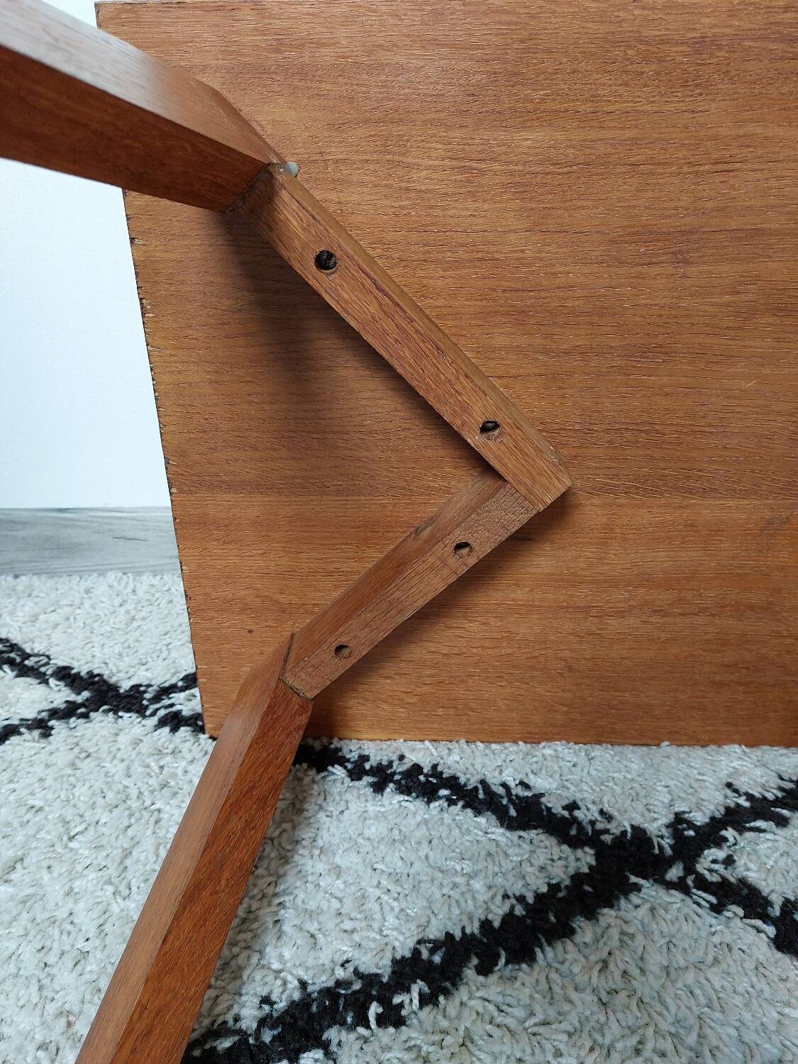 Coffee table with wooden compass legs