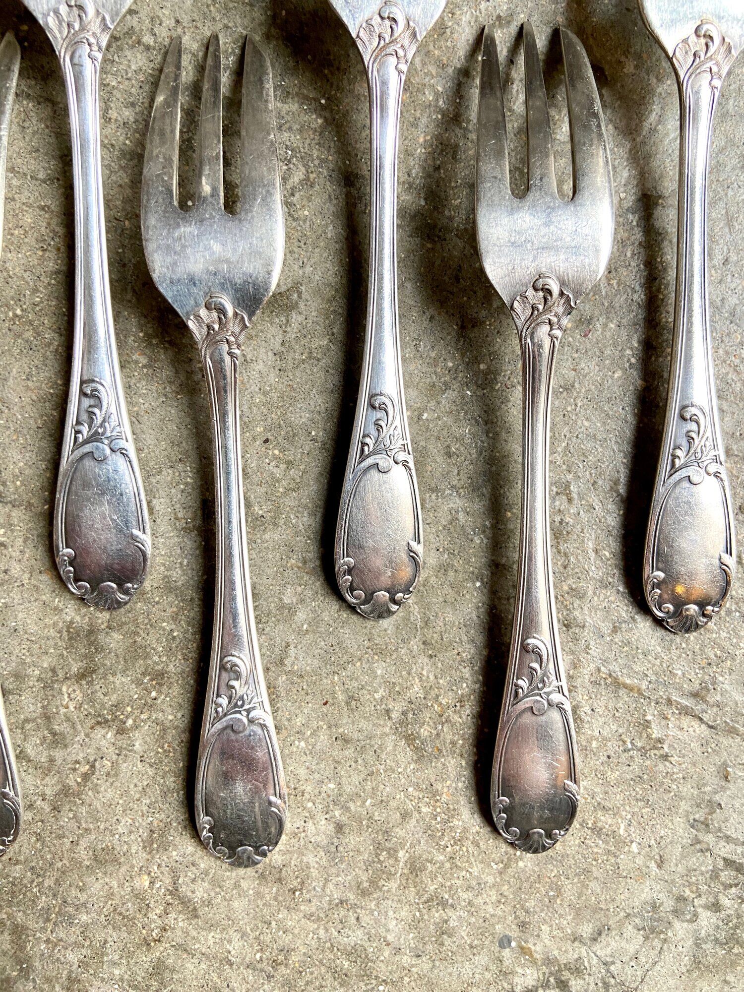 7 silver metal dessert forks