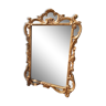 Old gilded mirror with Regency-style parcloses of 1930.