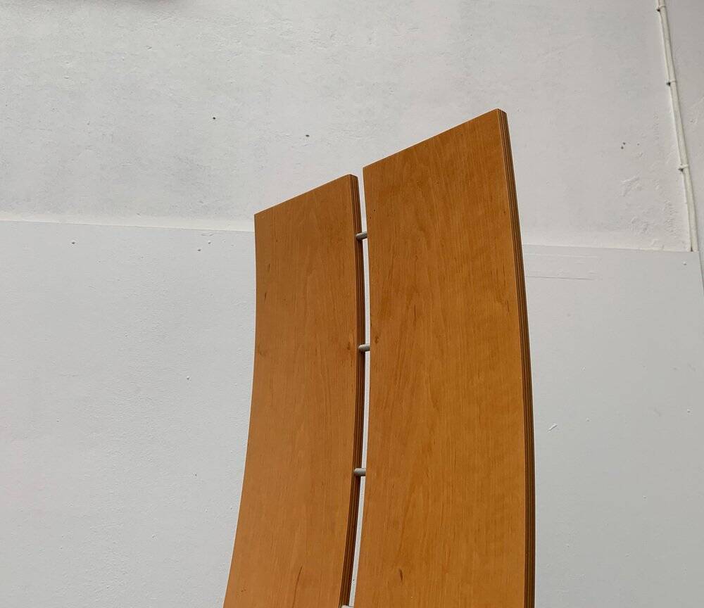 Postmodern chair with a high backrest