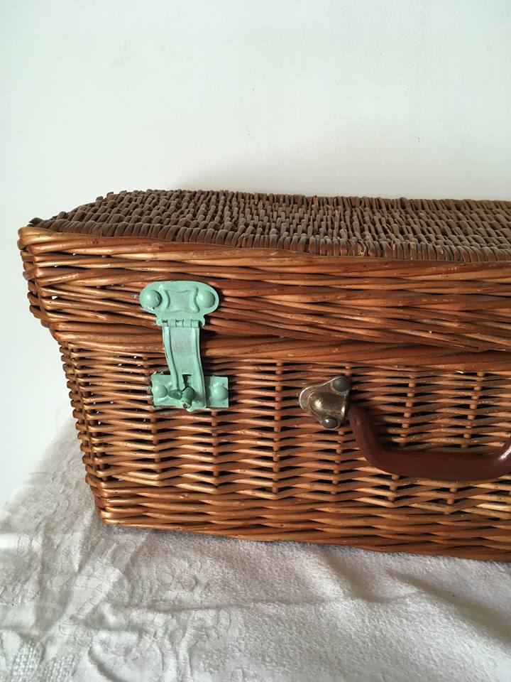 Wicker suitcase to store toys.