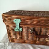 Wicker suitcase to store toys.