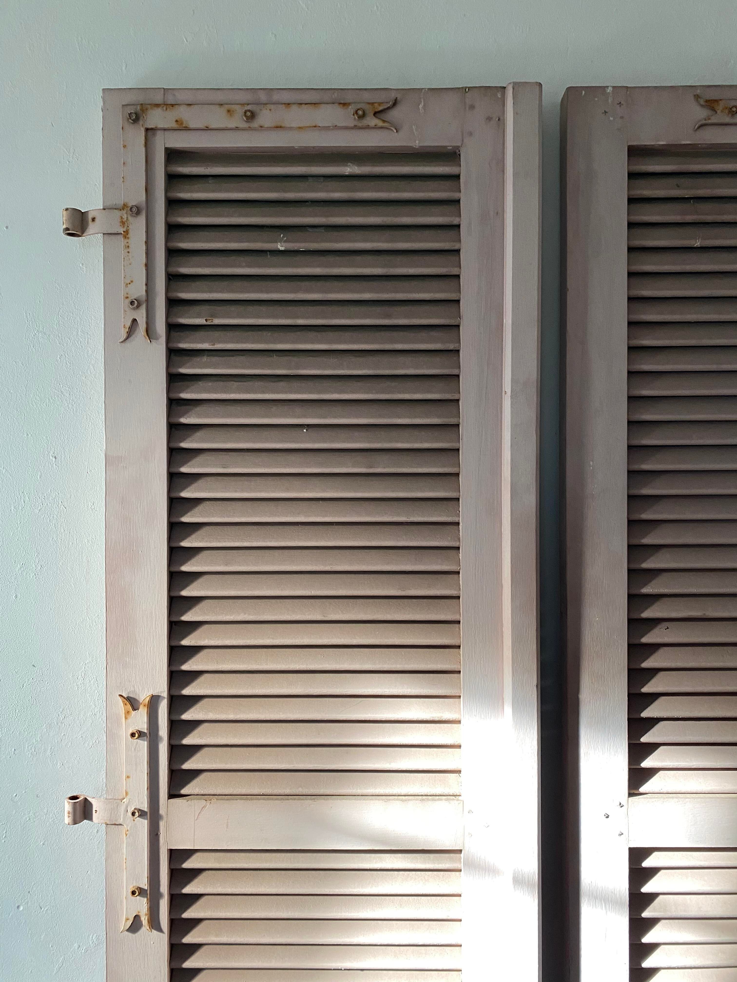 Pair of shutters with wooden shutters in old pink color