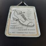Old illustration "Exterior of a shoe" inserted under mirror