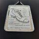 Old illustration "Exterior of a shoe" inserted under mirror