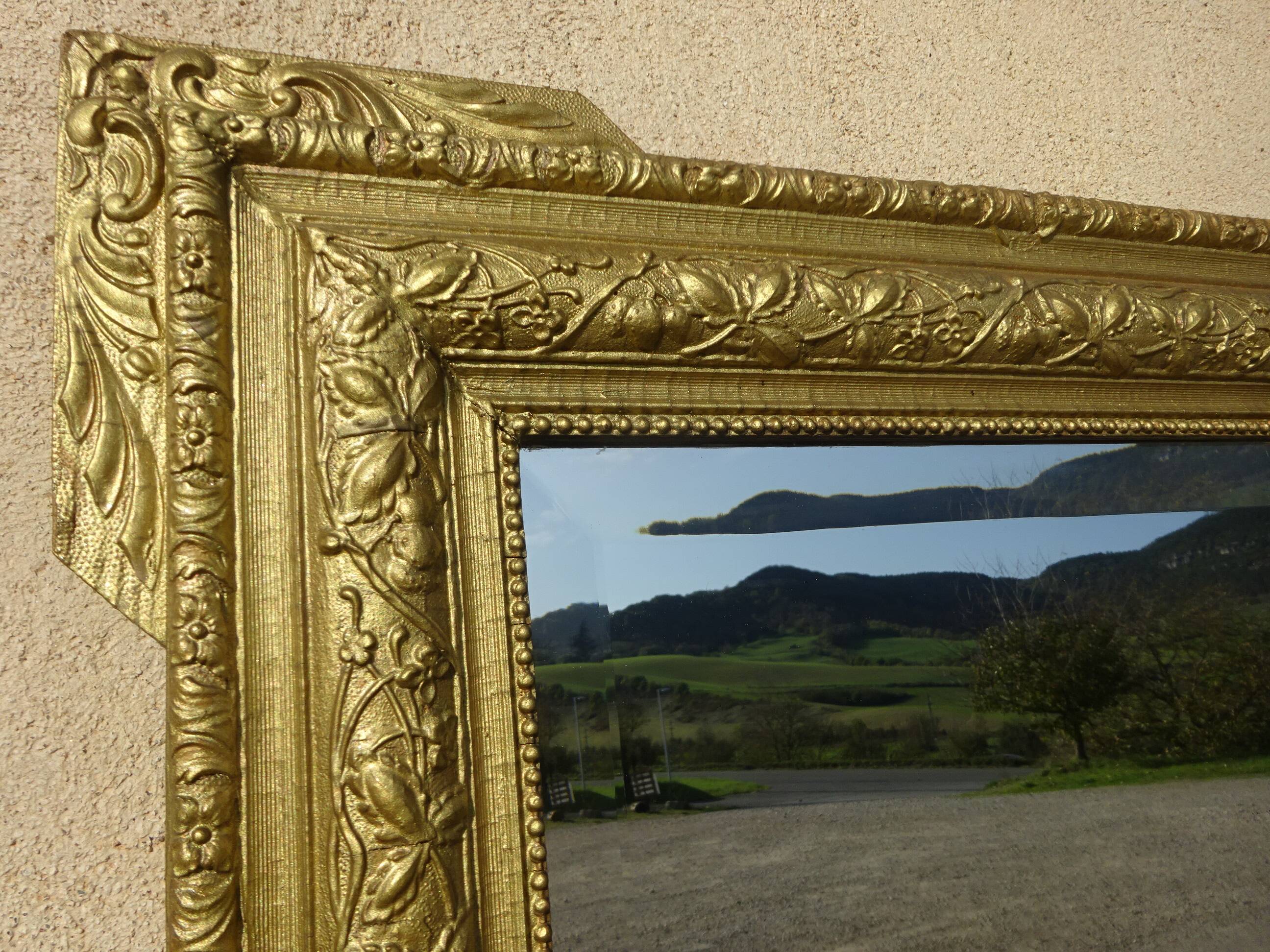 Antique mercury mirror in the Napoleon III style.