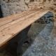 Old French industrial table with a cast iron base and a pine top.