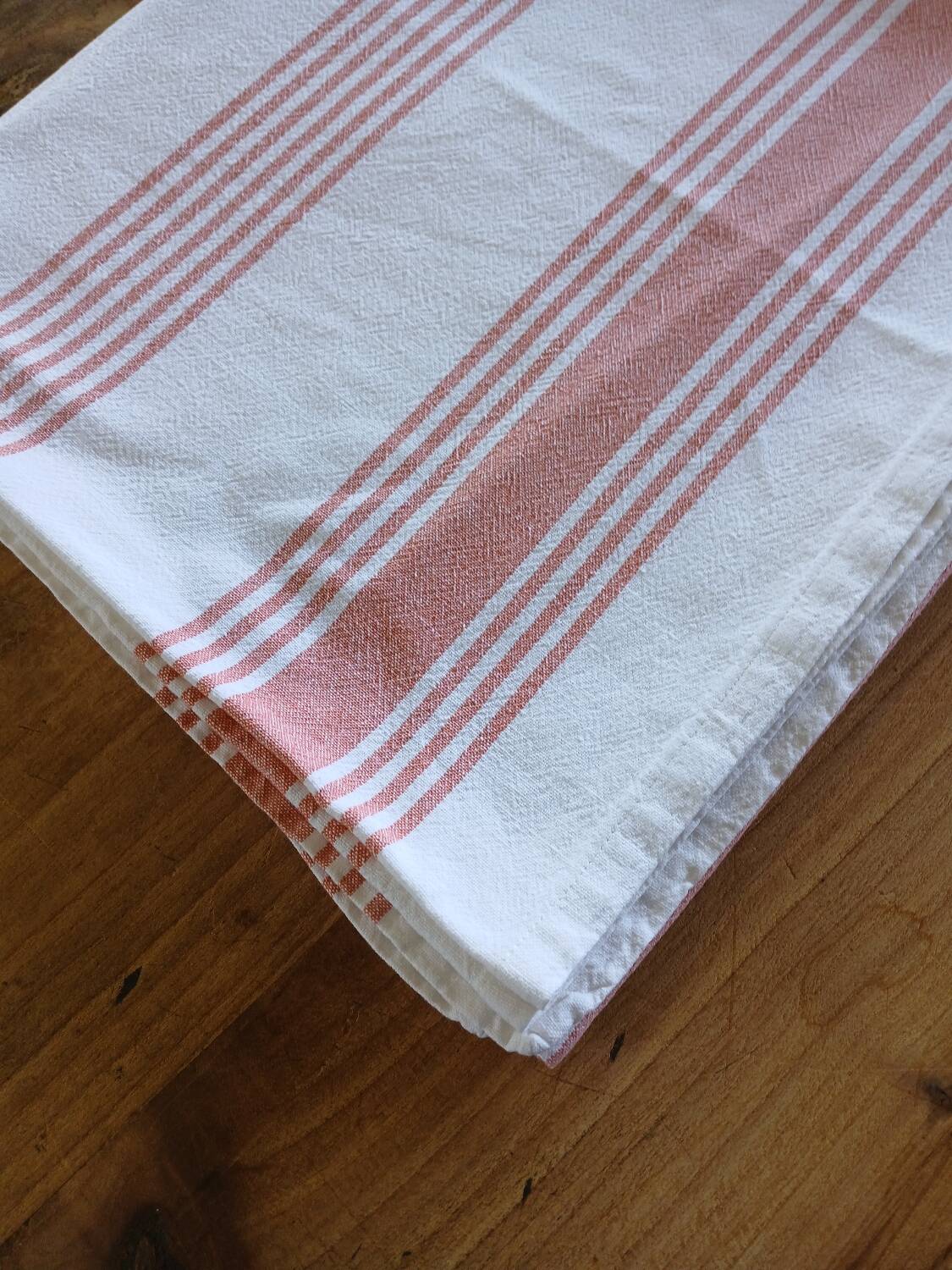 Old pink and white tablecloth