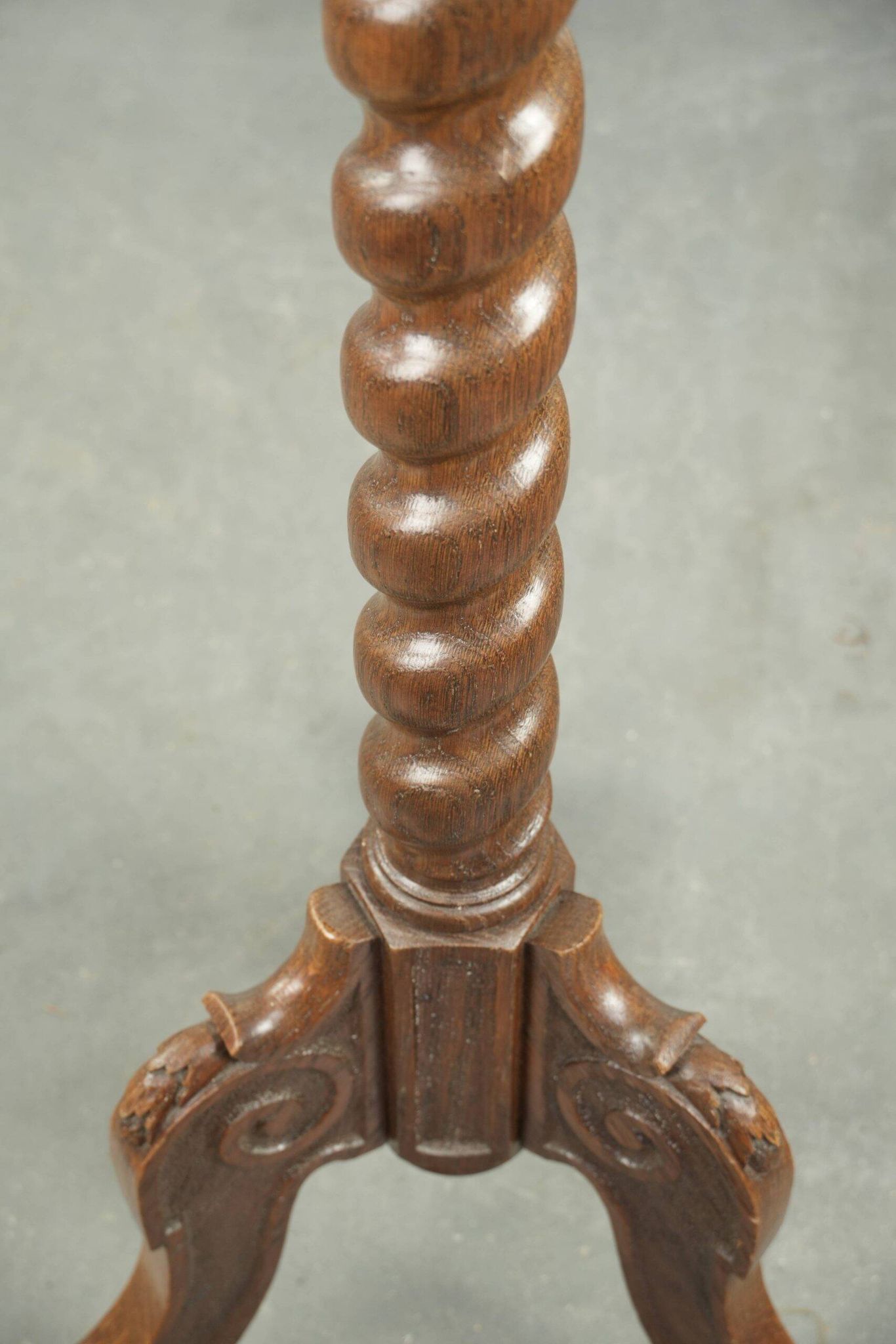 Antique tall oak plant/side table with wood carving and a turned leg