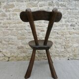 Brutalist chair in carved solid wood, around 1950.