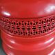 Vintage globe lamp with a metal base, perforated and lacquered in red.
