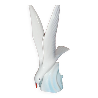 Albatross arriving on rock (porcelain trinket)