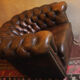 Chesterfield club armchair in patinated chestnut coloured leather