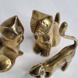 Set of three brass cats