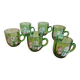 Set of 6 dark green liqueur glasses with handle and floral decoration.