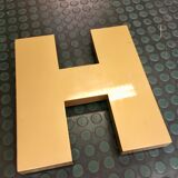 Golden sign letter h