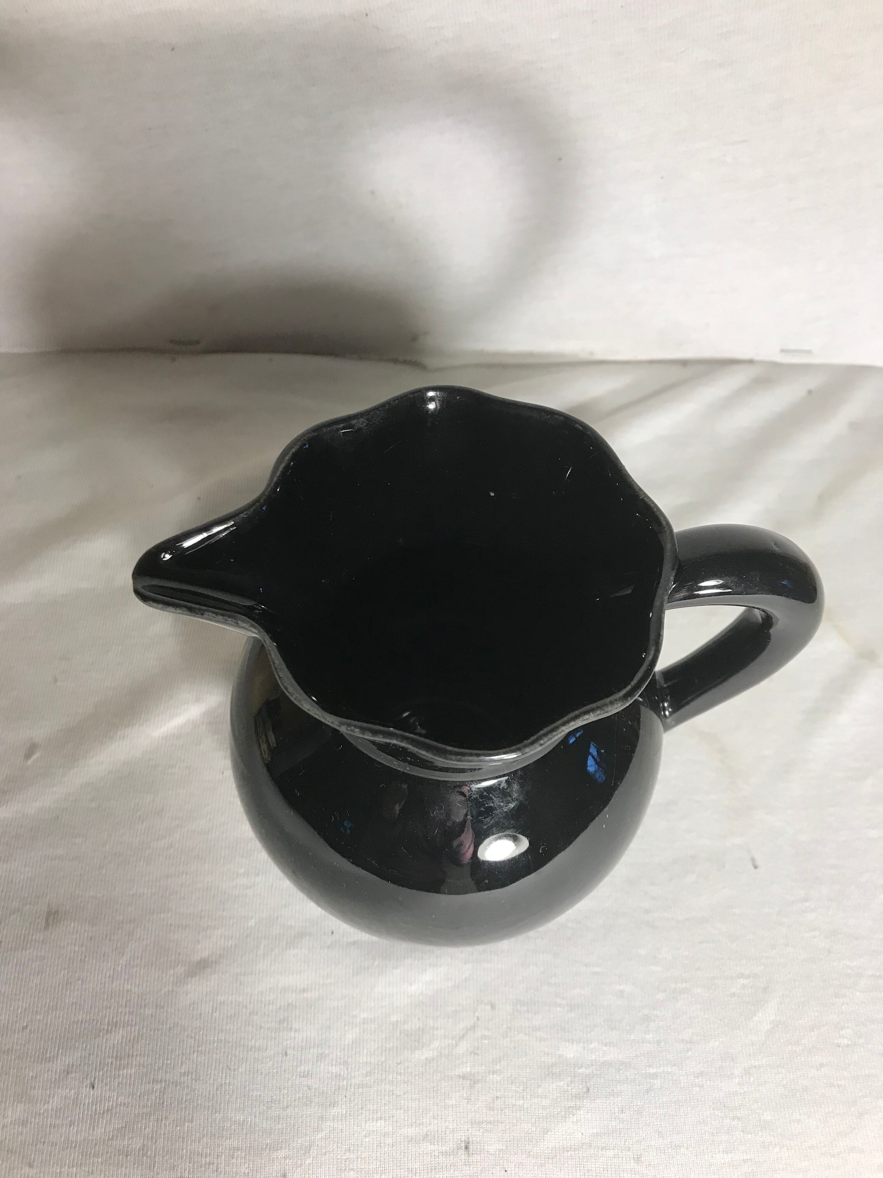 Former enamelled ceramic black pitcher 70s