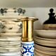 Candlestick in gilded brass and blue earthenware