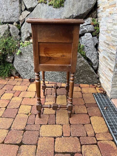 Wooden bedside table with marble top