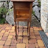 Wooden bedside table with marble top