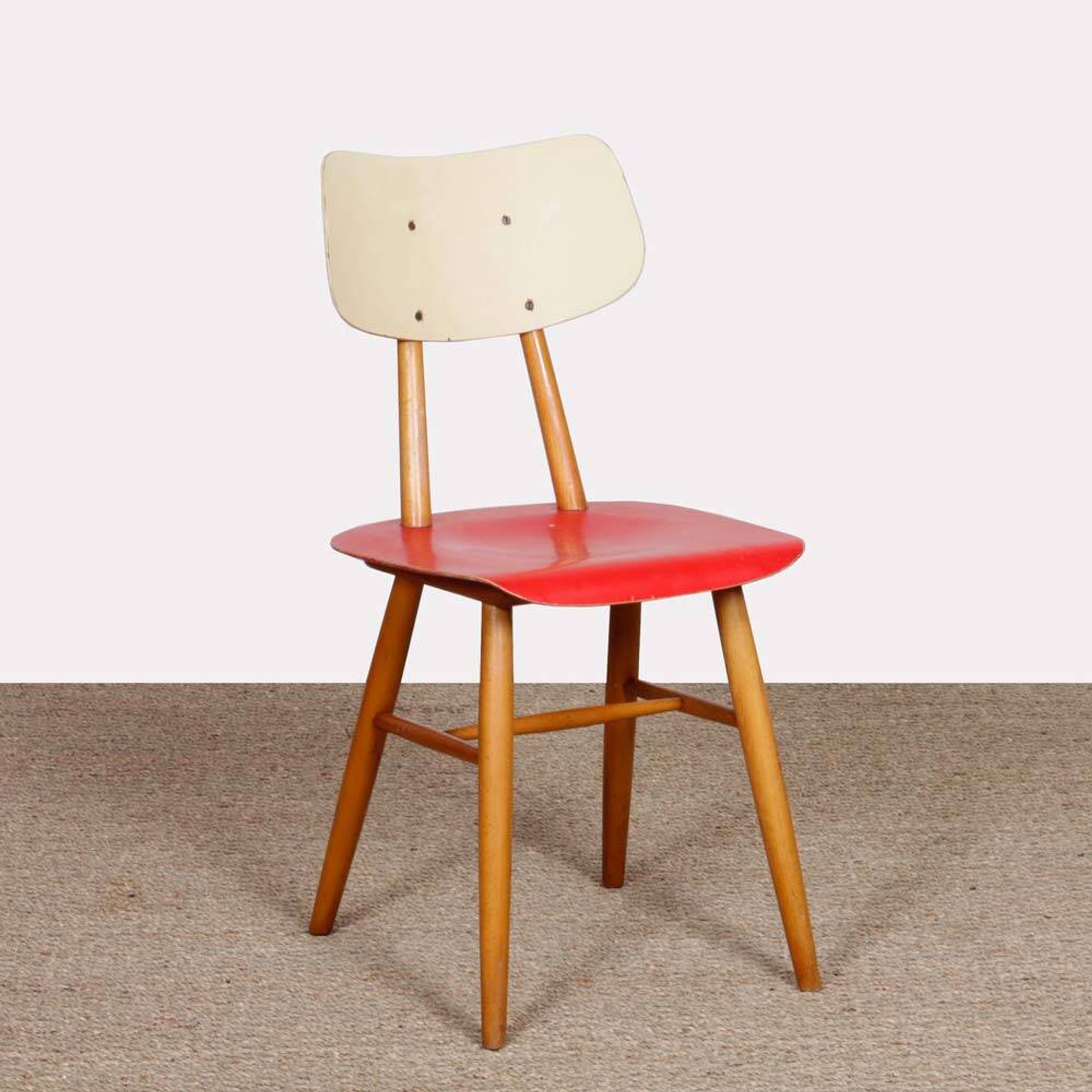 Red chair produced by Ton in the 1960s