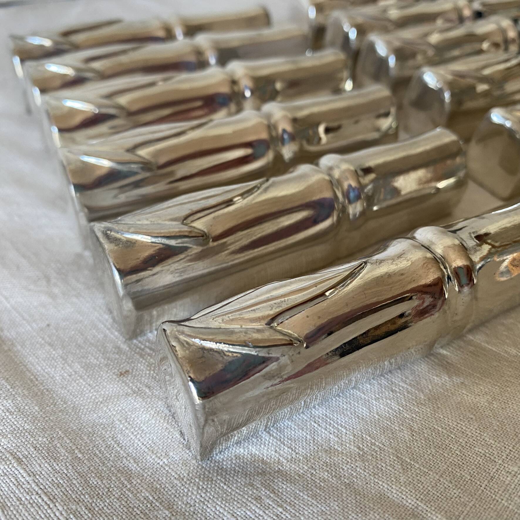 Silver bamboo knife rests from the 1980s.