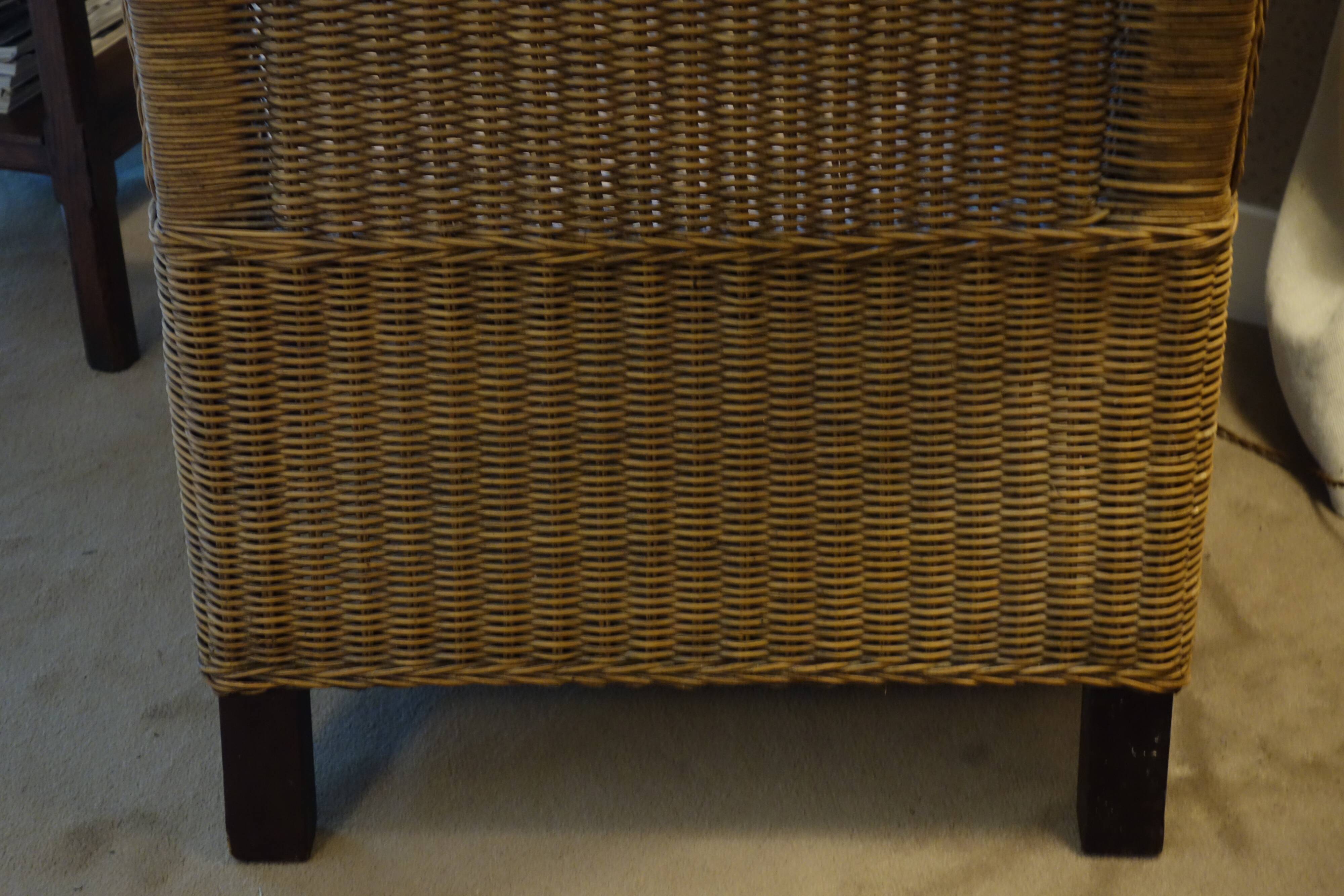 comfortable colonial-style armchair in rattan and mahogany