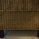 comfortable colonial-style armchair in rattan and mahogany