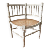 19th-century corner fireplace armchair, wood and cane.