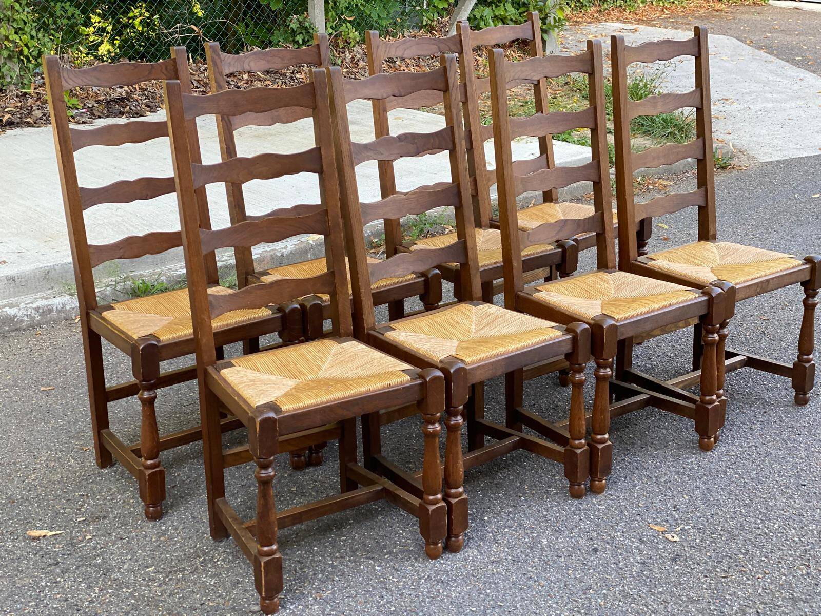 8 solid oak chairs in medium oak with straw, farmhouse style, high back.