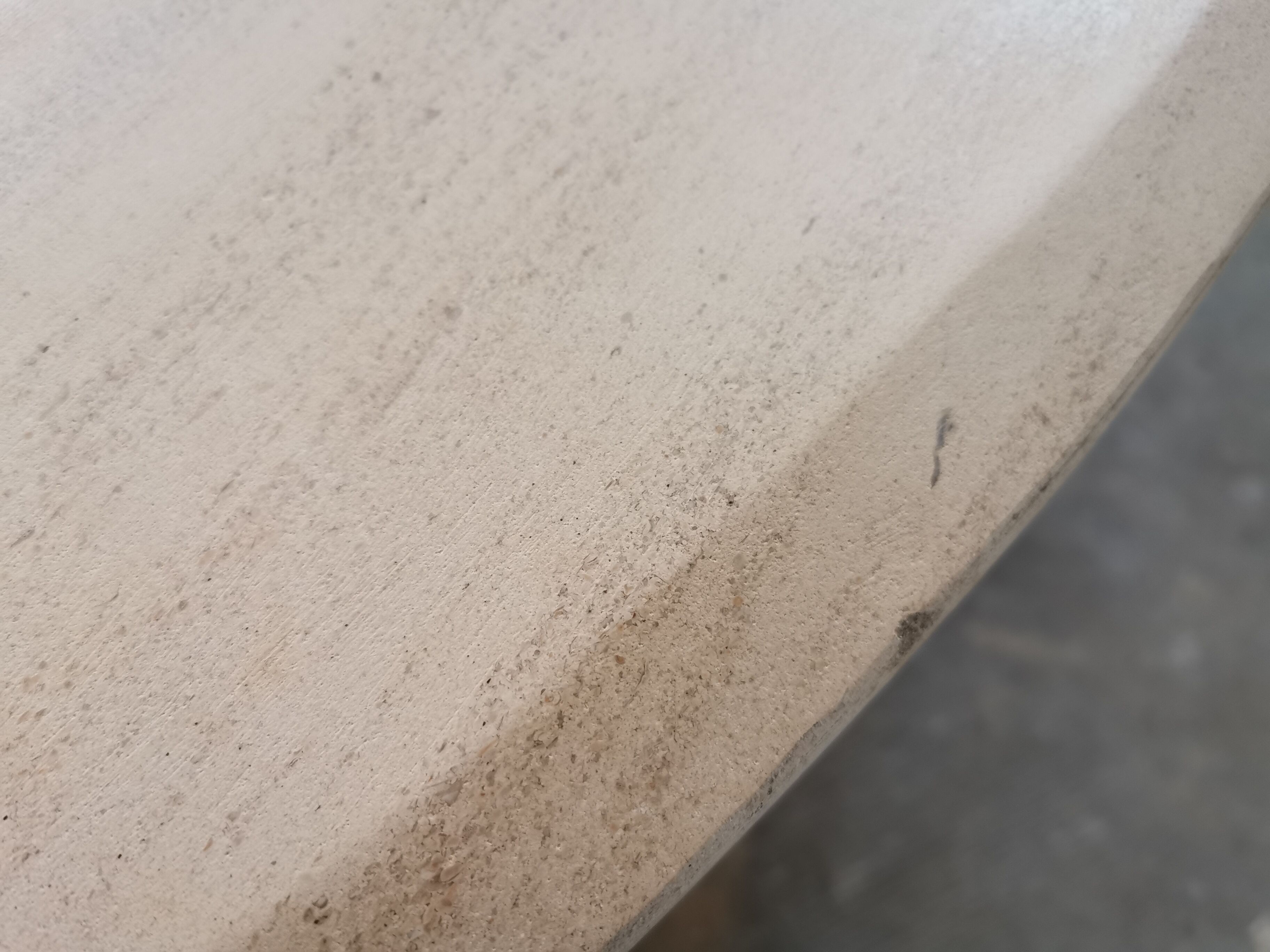 Large oval coffee table in travertine and metal