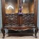 Curved library with two walnut doors, in Louis XV style.